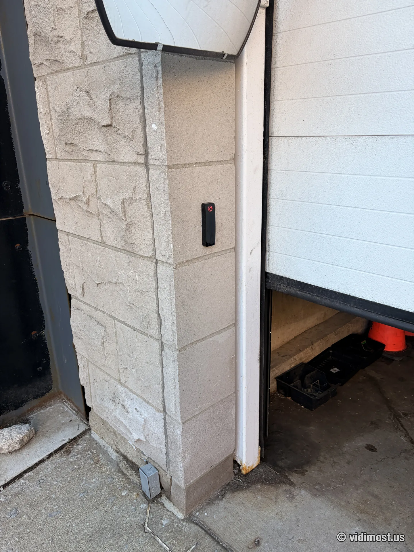 Brivo reader mounted at a Chicago parking garage entrance next to an overhead door