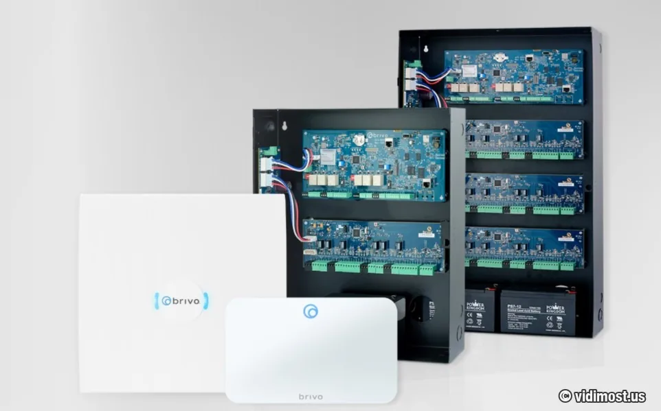 Brivo access control hardware family — ACS panels in black enclosures with expansion boards and battery backup, and ACS100 white edge controllers