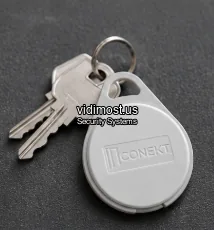 Farpointe Conekt CSK-2 keyfob on a keyring next to house keys